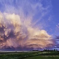  A Retreating Thunderstorm at Sunset 